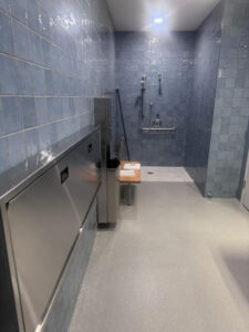New bathroom, locker rooms and family room, including new adult changing table.